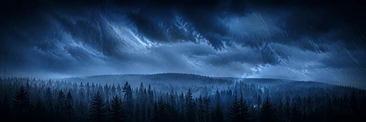 Wind-driven rain moving through ancient pines